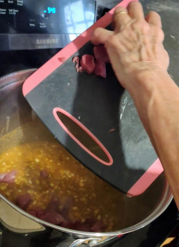 Adding pork tenderloin to the chickpea chili